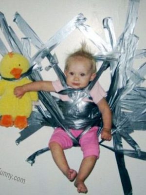 Bad parenting: hold the baby on wall with tapes