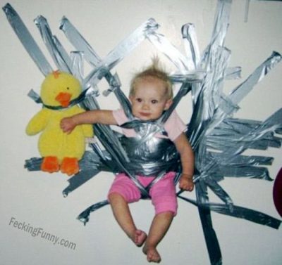Bad-Parenting--handle-naughty-kids-holding-baby-on-wall-with-tape