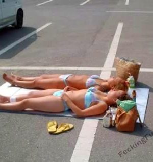 Sexy blondes enjoying sunbath in car park