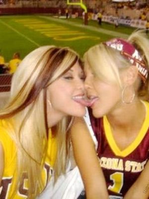 Lesbian football fans kissing