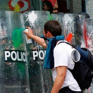 funny-protester-attacking-police-with-paint