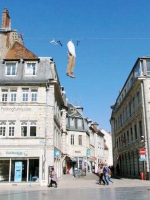 Hanging clothes between two buildings