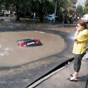 woman-parking-car-in-pond