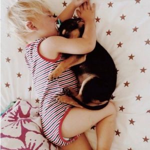 funny-kid-sleeping-with-dog
